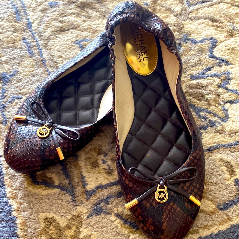 Authentic Michael Kors snake skin flats. Only worn once for a few hours.